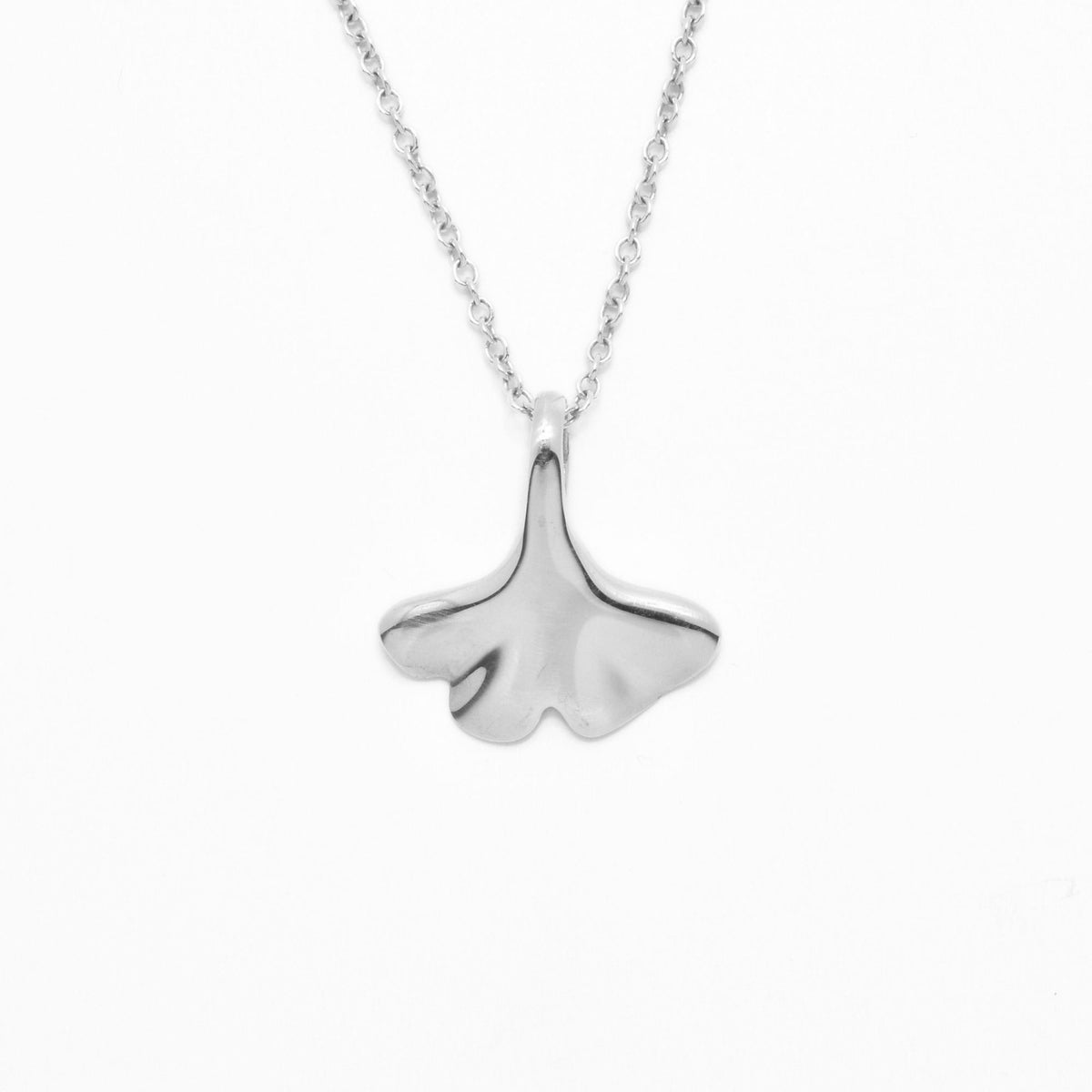 Direct studio front view of the Botanical Ginkgo Leaf Pendant 14mm petite in solid sterling silver, emphasizing the delicate architectural contours from Gina Rose Atelier
