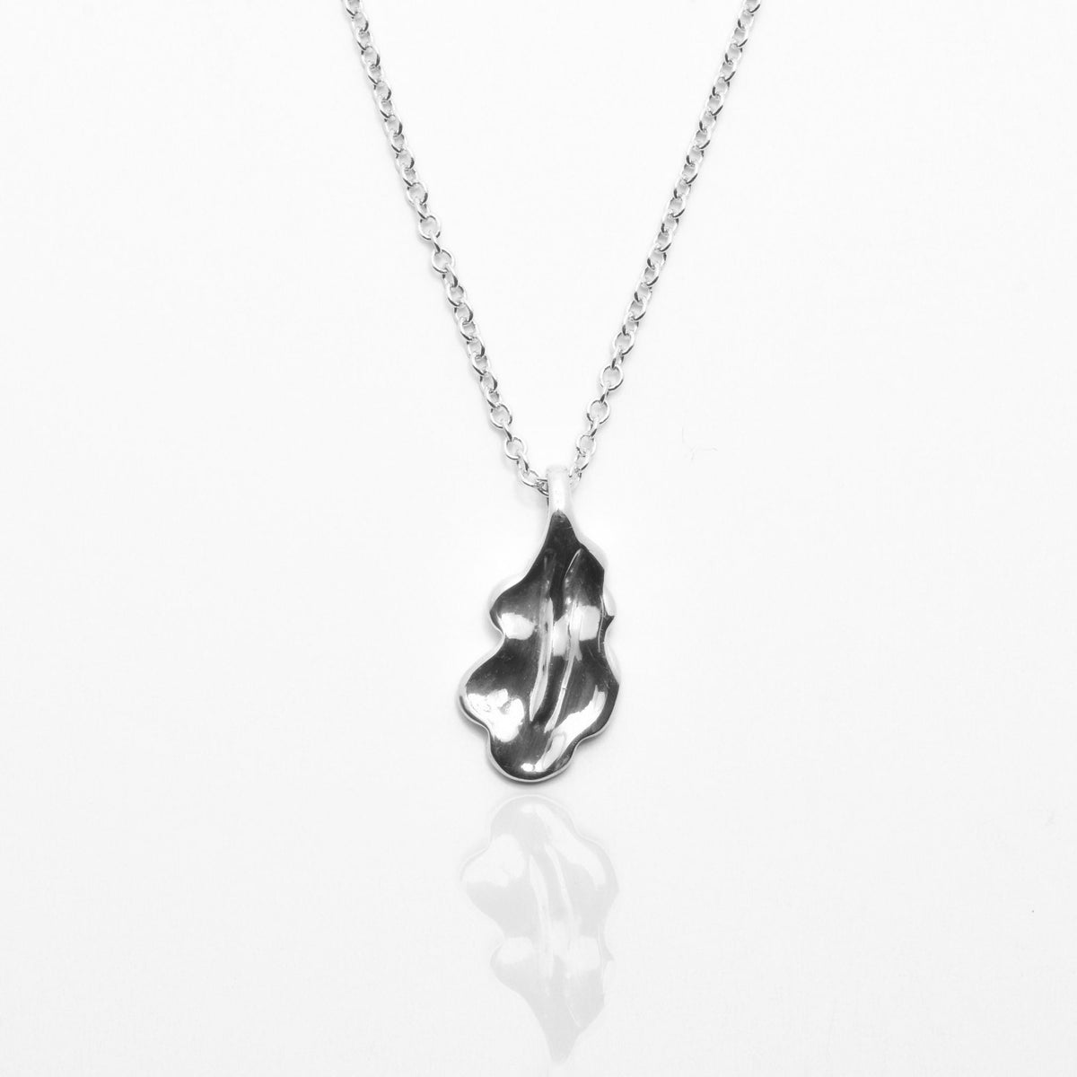 Close-up front view of the Botanical Oak Leaf Pendant 15mm petite in sterling silver, showcasing master-crafted organic lobed geometry and polished finish