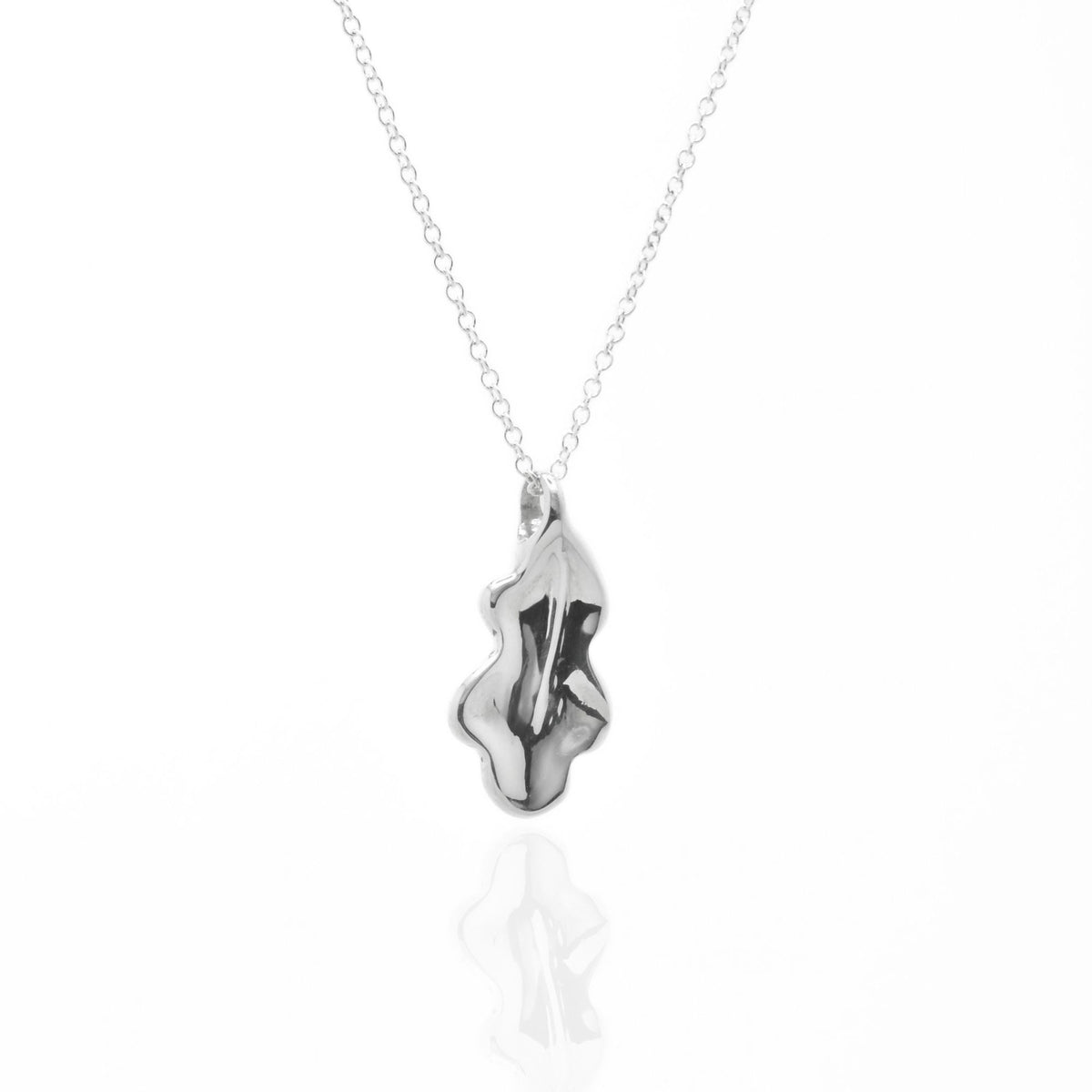 Close-up front view of the Botanical Oak Leaf Pendant 20mm grande in sterling silver, showcasing master-crafted organic lobed geometry and polished finish by Gina Rose Atelier