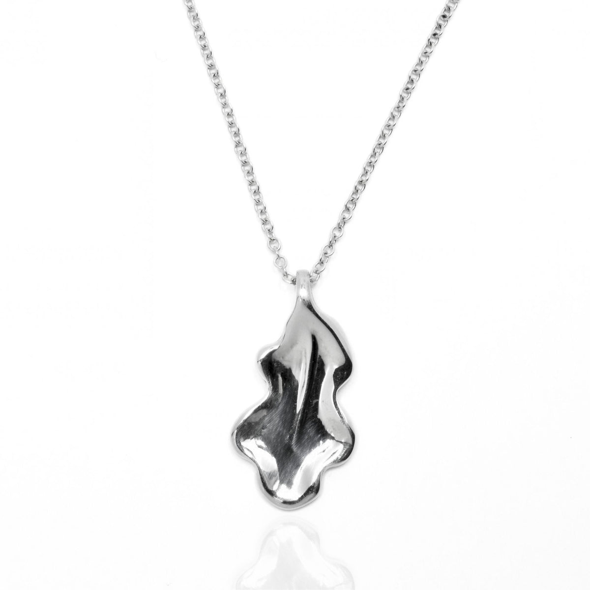 Dynamic studio perspective and reflection of the Botanical Oak Leaf Pendant 20mm in solid sterling silver by Gina Rose Atelier.