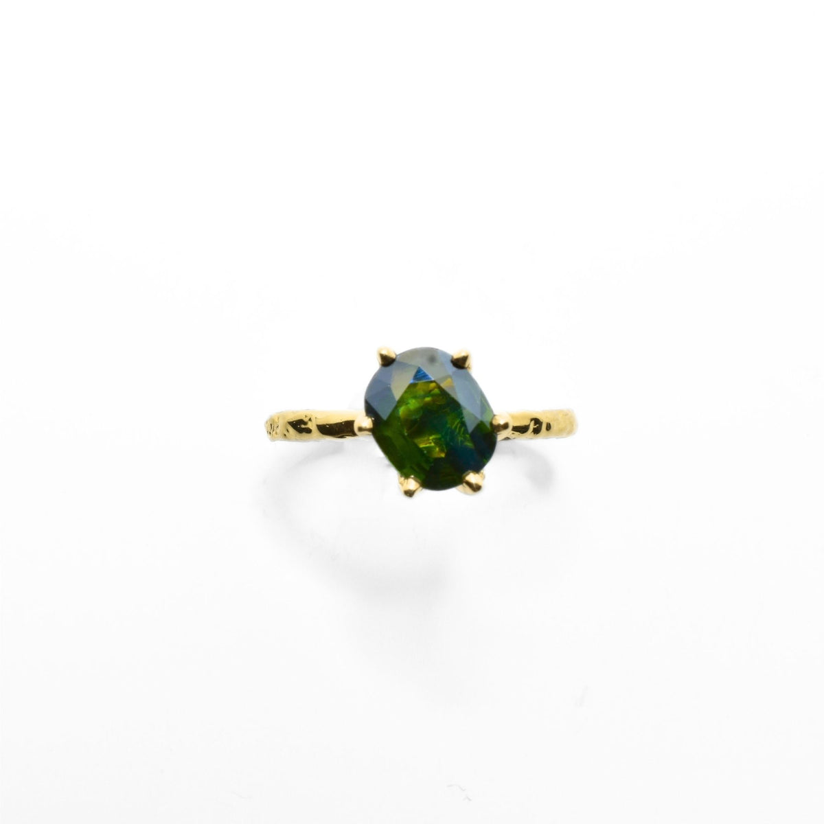 Close-up front view of the Green Sapphire Oval ring from the Archive Series in 18k yellow gold, showcasing master-crafted organic gold prongs and vibrant green sapphire gemstone by Gina Rose Atelier.
