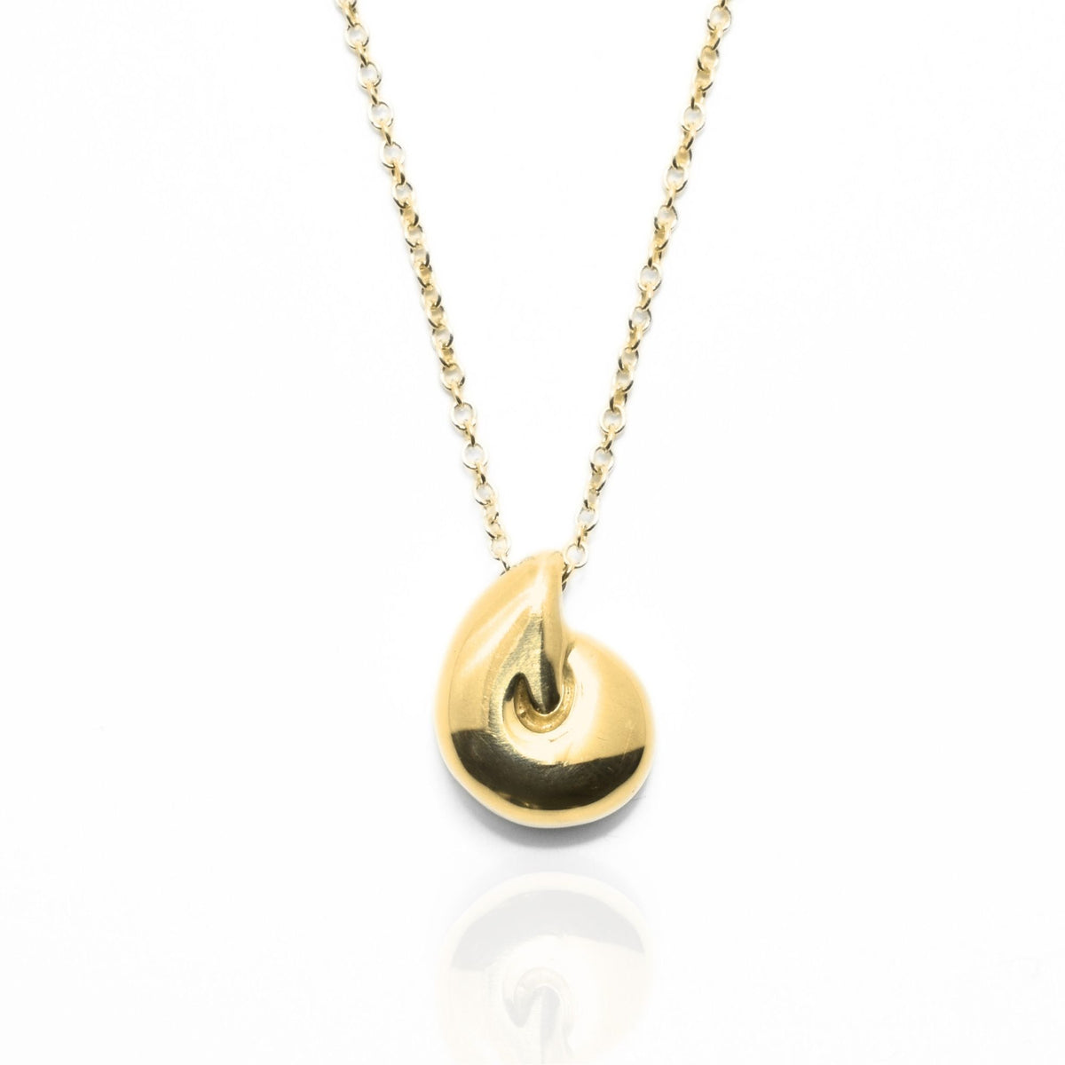 Angled perspective of the Pelagic Nautilus Pendant 11mm petite in 18k yellow gold, displaying the integrated bail and organic shell contour by Gina Rose Atelier.