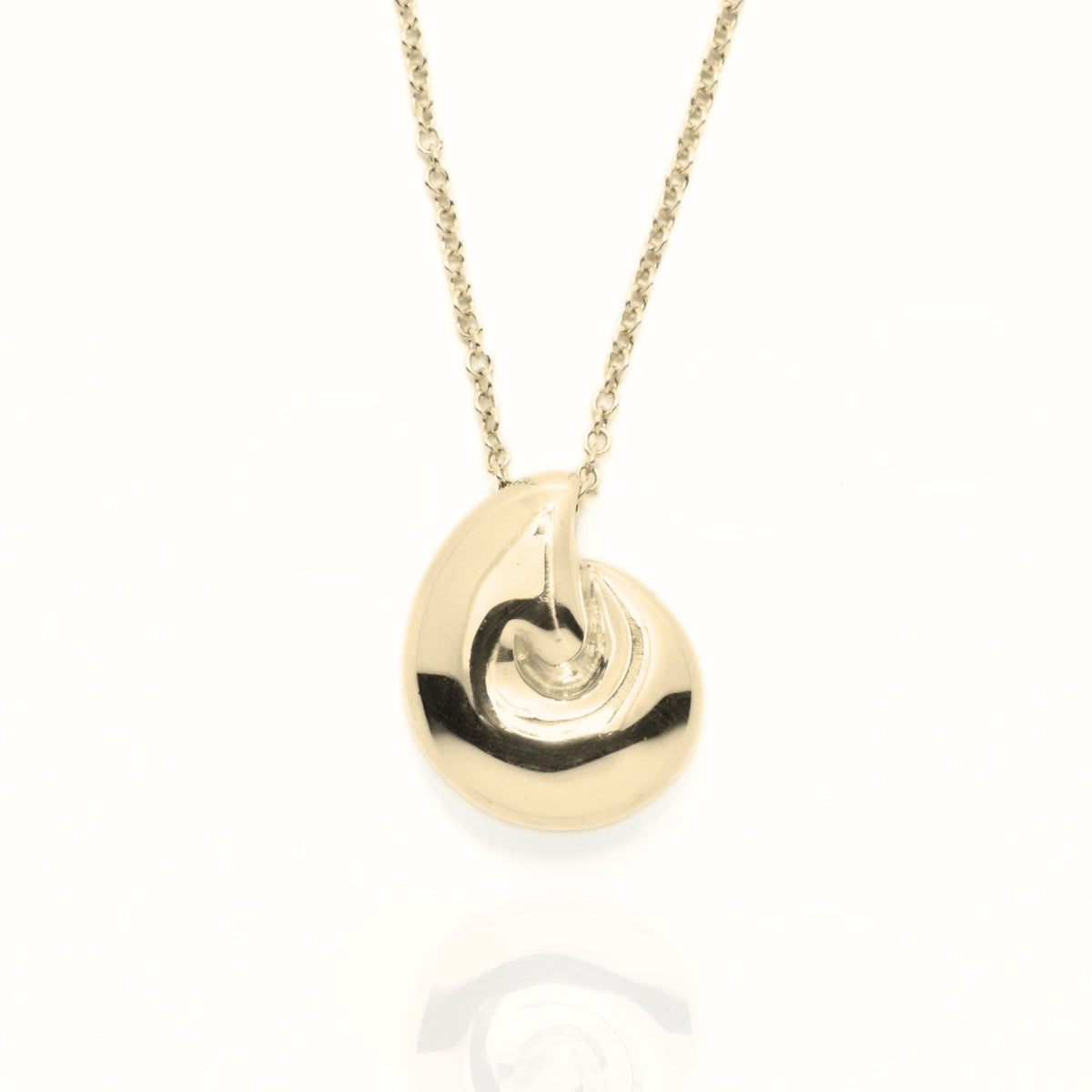 The Pelagic Nautilus Pendant in 14mm grande scale crafted in solid 18k yellow gold by Gina Rose Atelier, shown with a mirror studio reflection on a custom gold chain.
