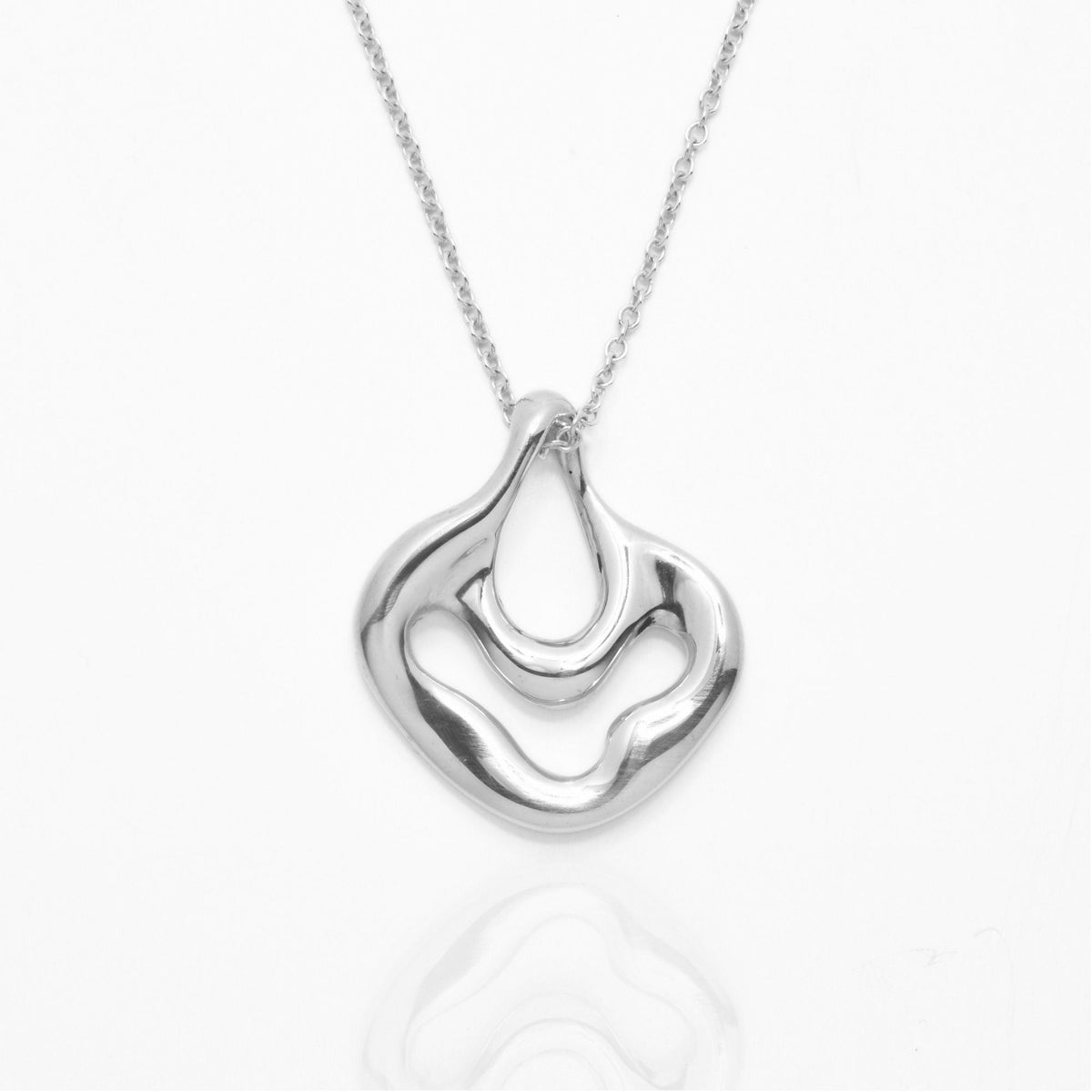 The Pelagic Sea Fan Pendant in 17mm petite scale crafted in solid sterling silver by Gina Rose Atelier, shown with a mirror studio reflection on a custom silver chain