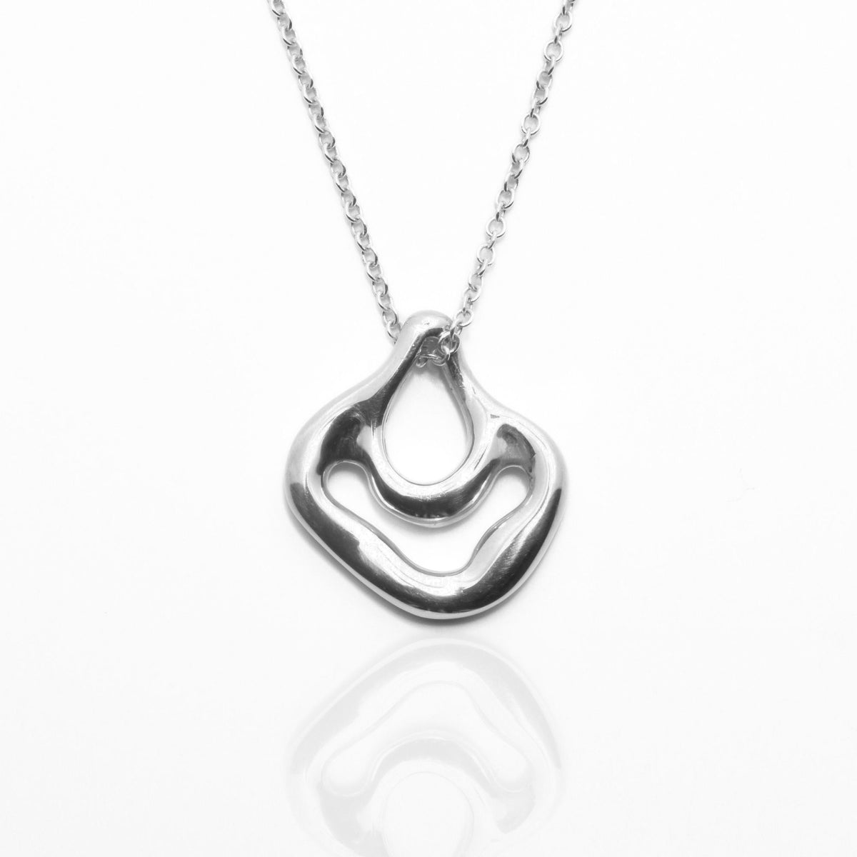 The Pelagic Sea Fan Pendant in 21mm moyen scale crafted in solid sterling silver by Gina Rose Atelier, shown with a mirror studio reflection on a custom silver chain