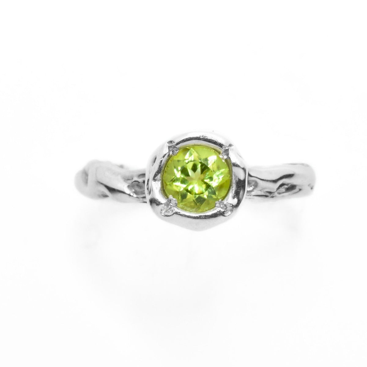 The Peridot Solitaire ring from the Archive Series crafted in solid sterling silver featuring a round-cut peridot gemstone by Gina Rose Atelier, shown against a clean studio background.