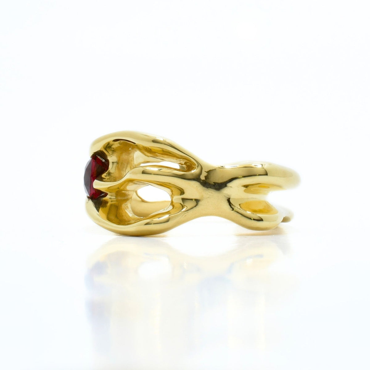 Angular side perspective of the Red Spinel Master Ring from the Archive Series in 18k yellow gold, showcasing bespoke fine jewelry craftsmanship by Gina Rose Atelier.