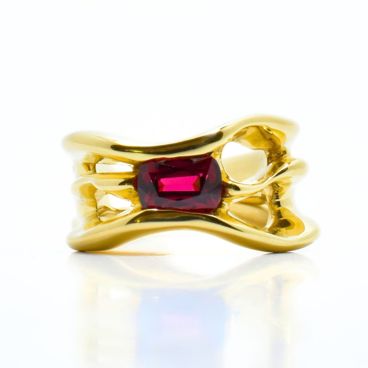 Close-up front view of the Red Spinel Master Ring from the Archive Series in 18k yellow gold, showcasing master-crafted organic gold architecture and vibrant red spinel gemstone by Gina Rose Atelier