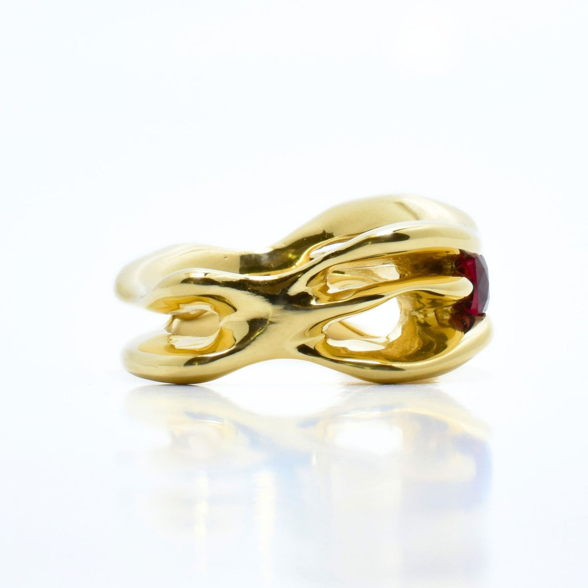 Side profile view of the Red Spinel Master Ring from the Archive Series, showcasing openwork 18k yellow gold gallery metalwork by Gina Rose Atelier.