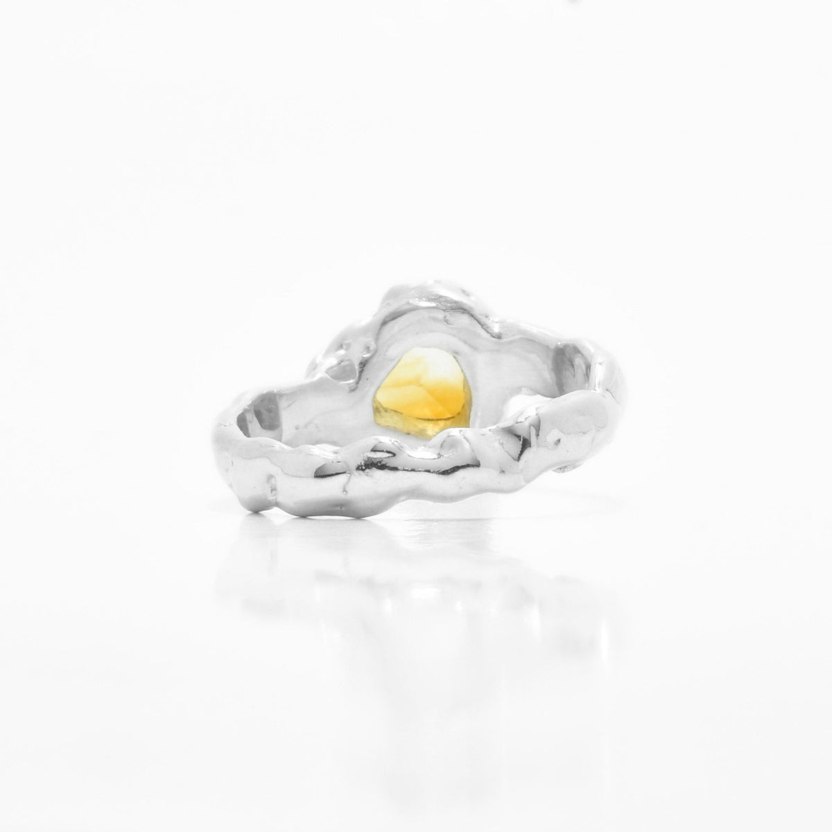 Underside gallery view of the Trillion Citrine Solitaire ring from the Archive Series, showcasing custom organic openwork metalwork in sterling silver by Gina Rose Atelier.