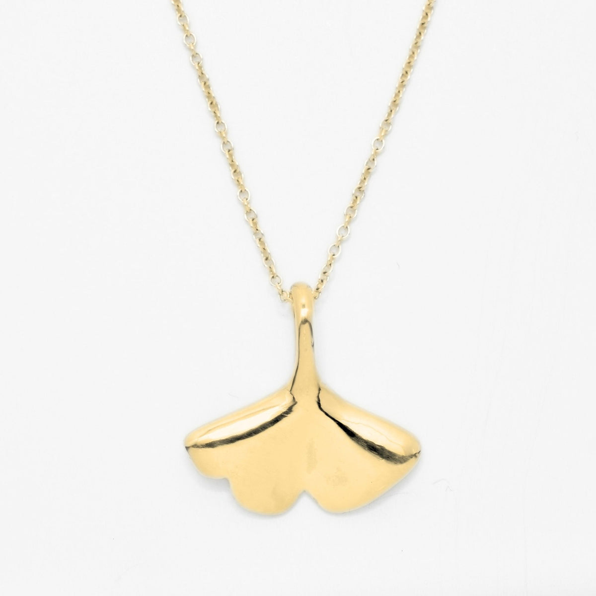 Close-up front view of the Botanical Ginkgo Leaf Pendant 20mm grande in 18k yellow gold, showcasing master-crafted organic geometry and polished finish by Gina Rose Atelier.