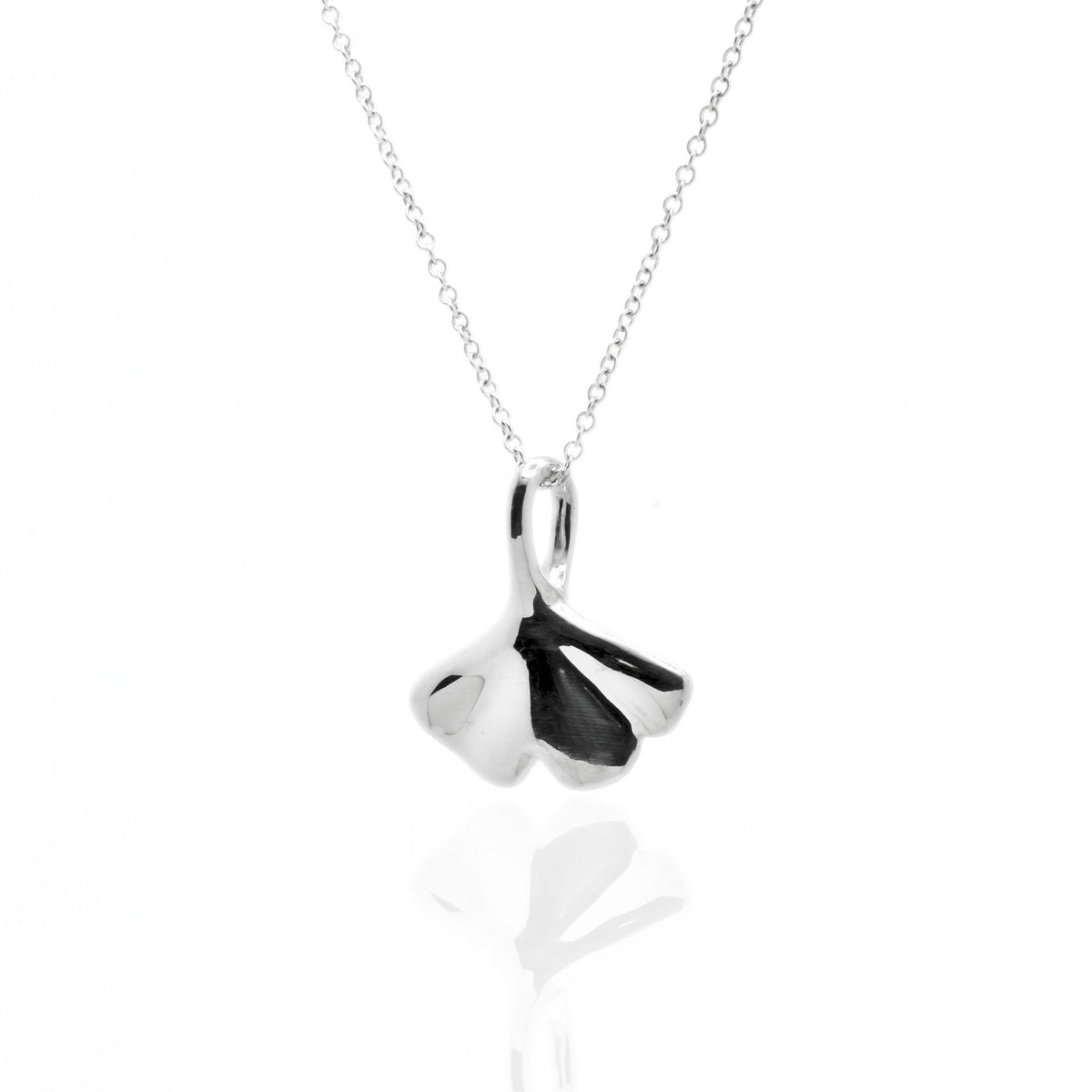 Angled perspective of the Botanical Ginkgo Leaf Pendant 20mm grande in sterling silver, displaying the integrated bail and organic contour by Gina Rose Atelier.