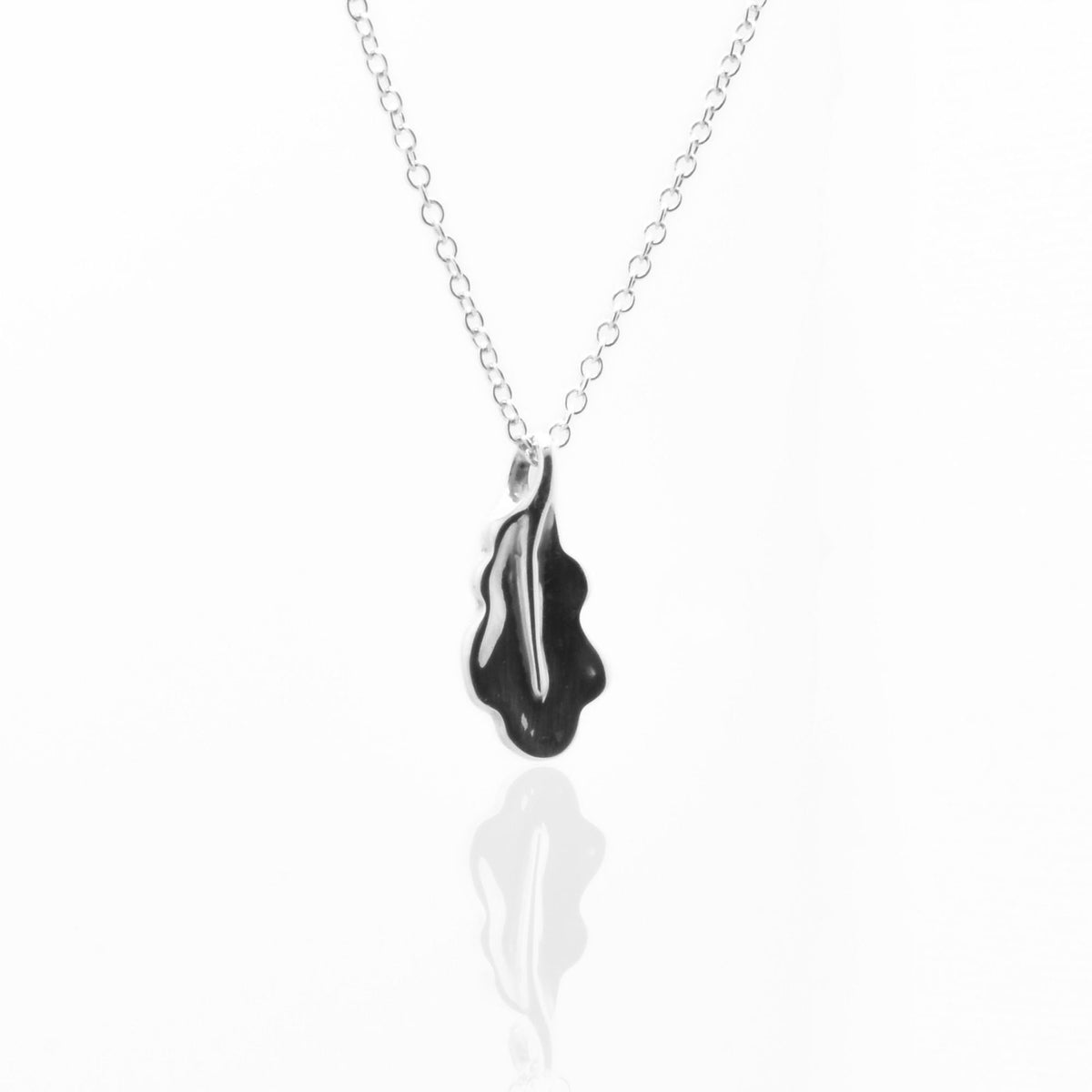 Direct studio front view of the Botanical Oak Leaf Pendant 15mm petite in solid sterling silver, emphasizing tactile volume and fine jewelry craftsmanship.