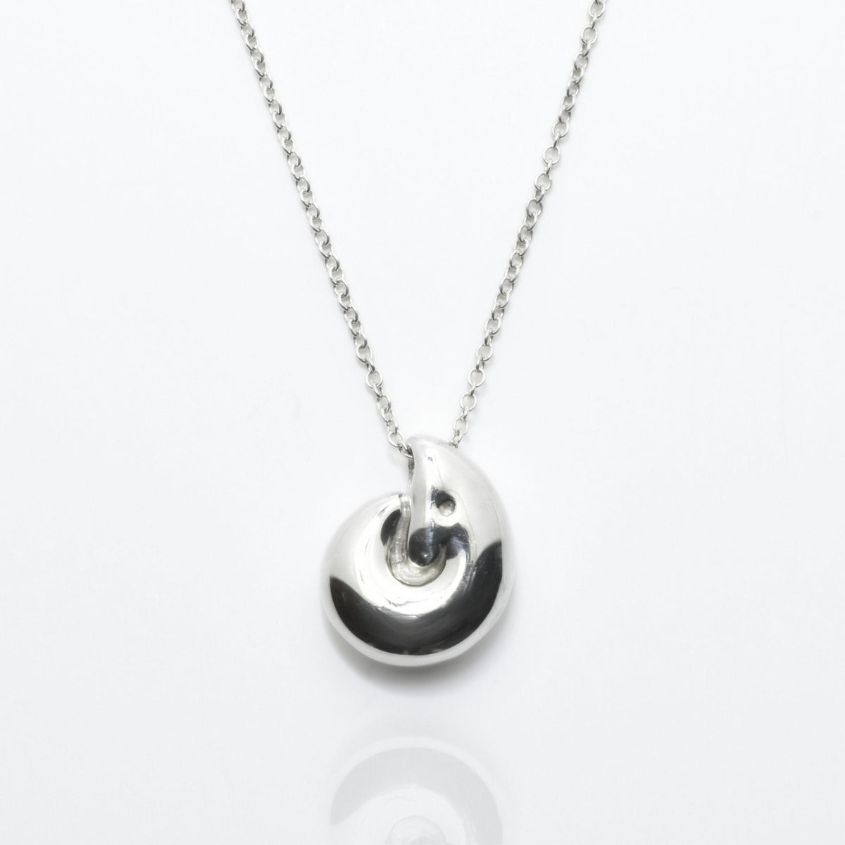 Additional studio perspective of the Pelagic Nautilus Pendant 14mm grande in solid sterling silver by Gina Rose Atelier