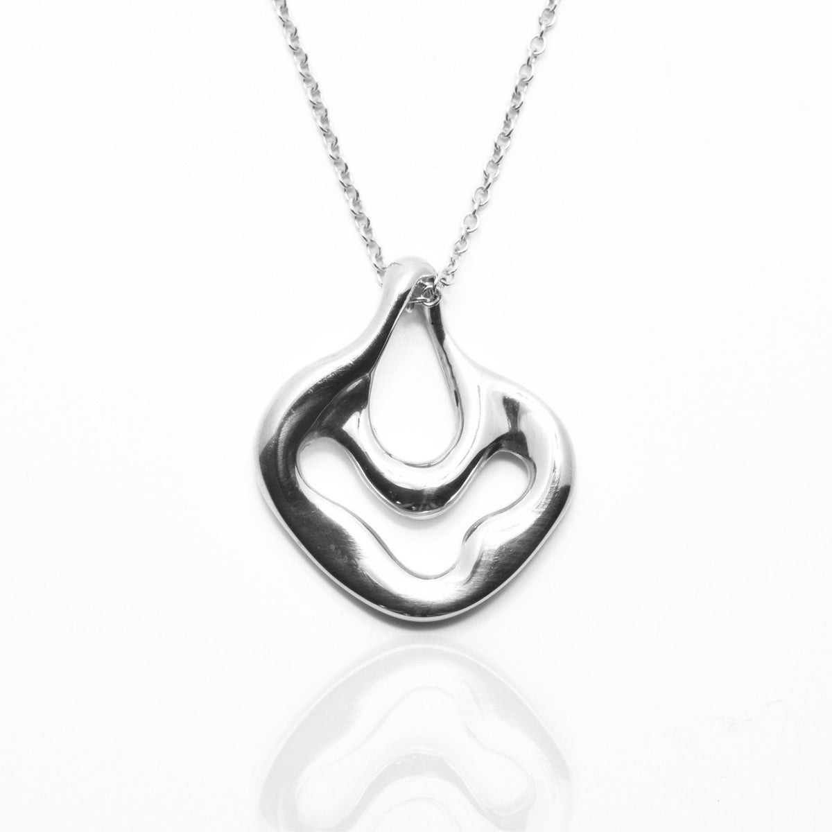 Close-up front view of the Pelagic Sea Fan Pendant 17mm petite in sterling silver, showcasing master-crafted organic openwork coral geometry and polished finish by Gina Rose Atelier.