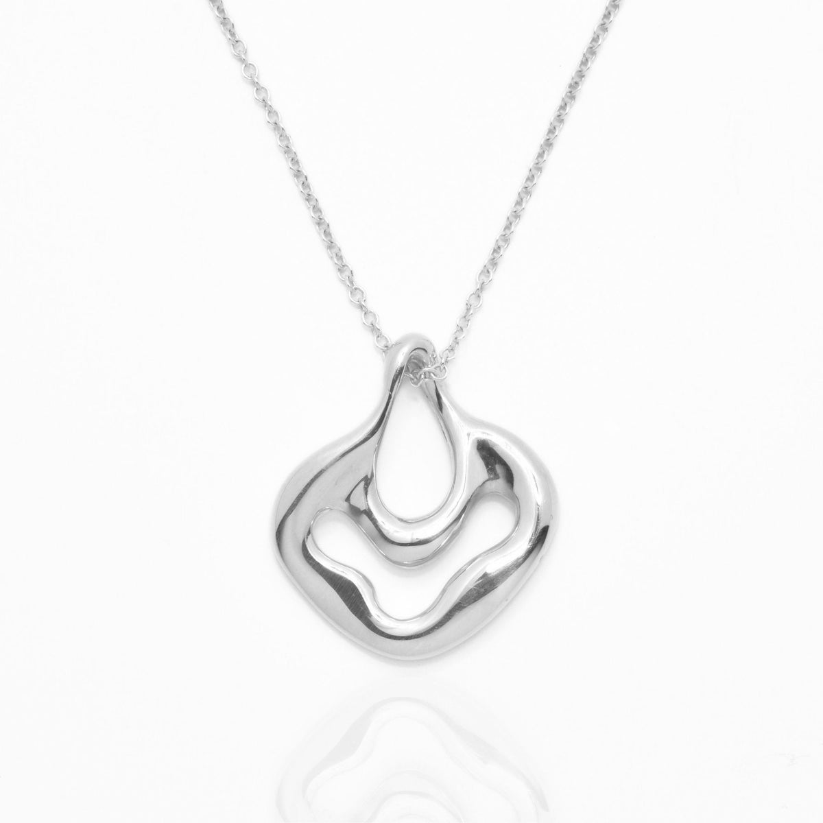 Direct studio front view of the Pelagic Sea Fan Pendant 17mm petite in solid sterling silver, emphasizing tactile volume and fine jewelry craftsmanship.