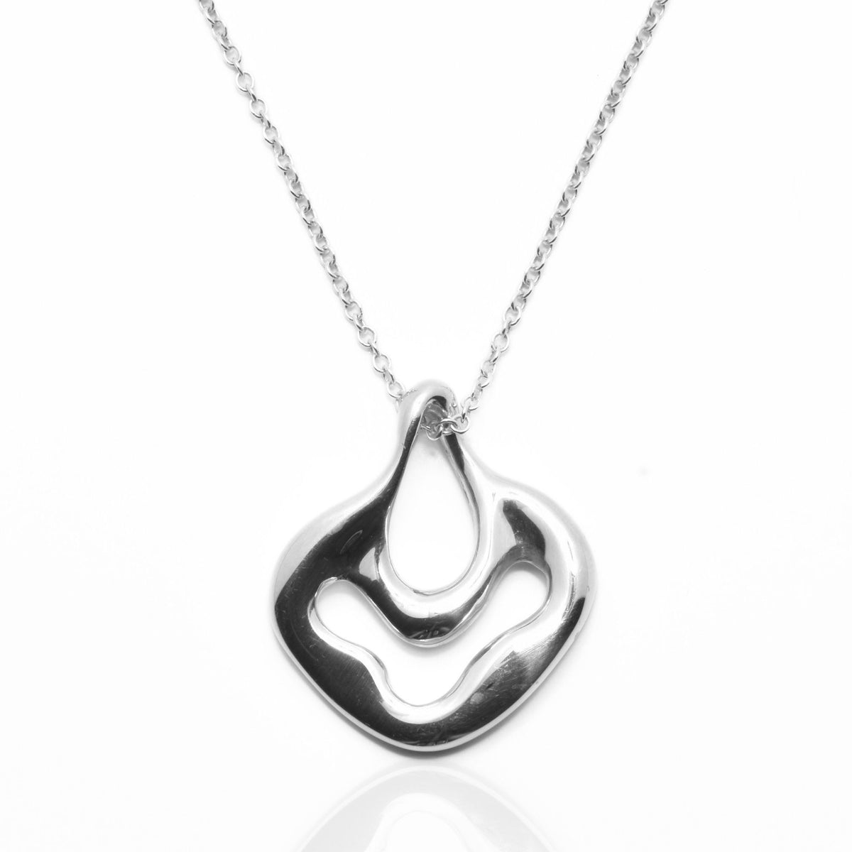 Dynamic studio perspective and mirror reflection of the Pelagic Sea Fan Pendant 17mm petite in solid sterling silver by Gina Rose Atelier