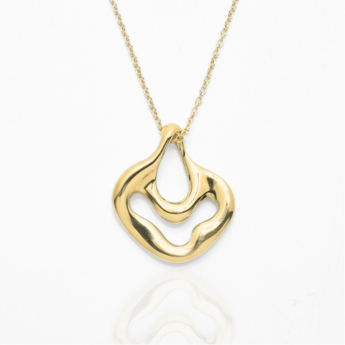 The Pelagic Sea Fan Pendant in 17mm petite scale crafted in solid 18k yellow gold by Gina Rose Atelier, shown with a mirror studio reflection on a custom gold chain