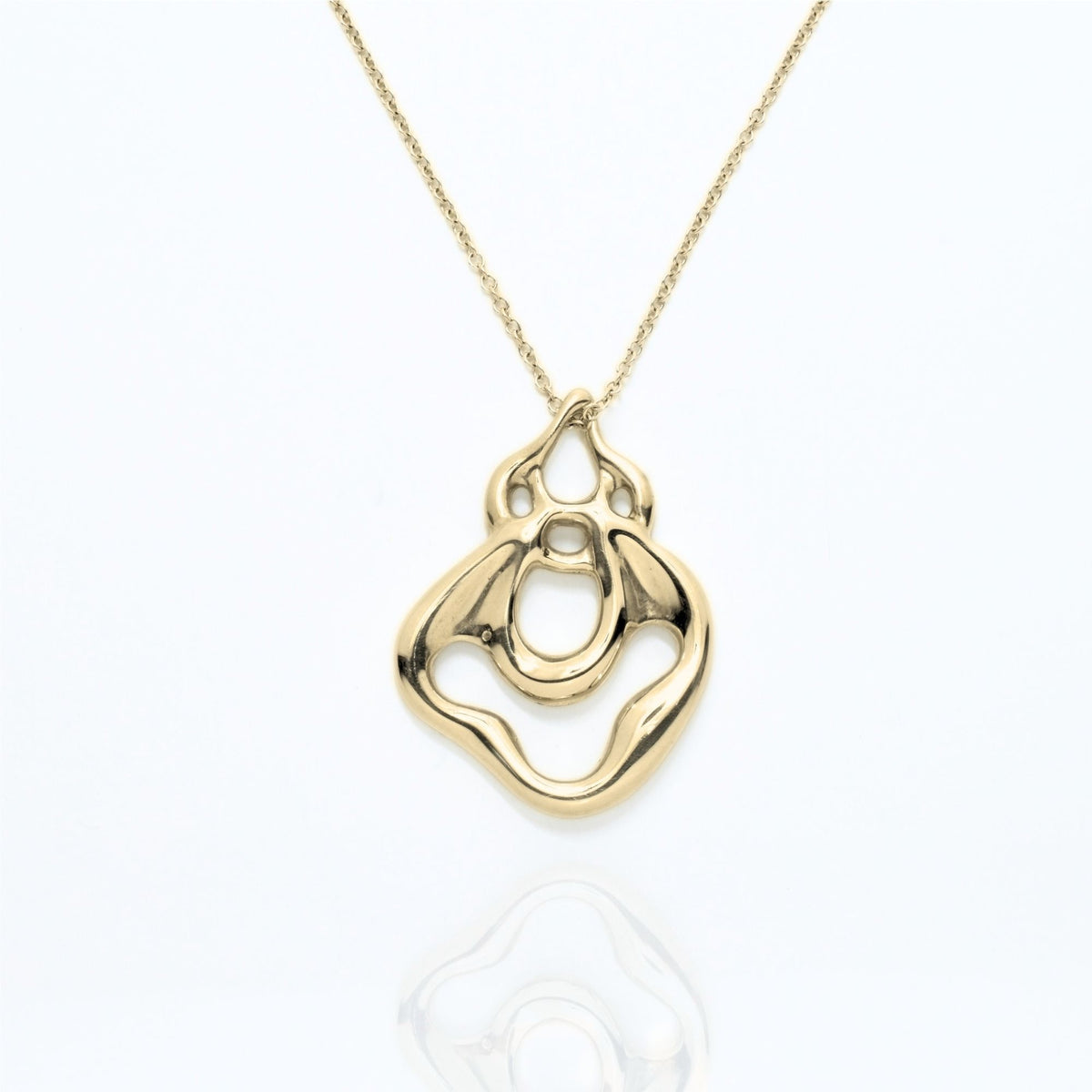 The Pelagic Sea Fan Pendant in 29mm grande scale crafted in solid 18k yellow gold by Gina Rose Atelier, shown with a mirror studio reflection on a custom gold chain.
