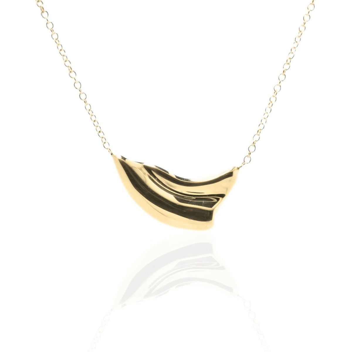 Close-up front view of the Pelagic Wave Pendant 18mm petite in 18k yellow gold, showcasing master-crafted sweeping crest geometry and polished finish by Gina Rose Atelier