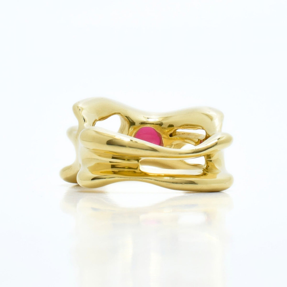 Three-quarter profile view of the Red Spinel Master Ring Archive Series in 18k yellow gold, highlighting organic volume and gemstone brilliance by Gina Rose Atelier.